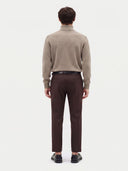 Model wearing the Cashmere Turtleneck Sweater in Taupe, back view
