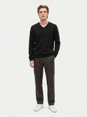 Model wearing the Cashmere V-Neck Sweater in Black, full-length front view