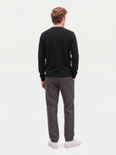Model wearing the Cashmere V-Neck Sweater in Black, back view