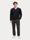Model wearing the Cashmere V-Neck Sweater in Navy, full-length front view