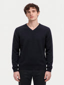 Model wearing the Cashmere V-Neck Sweater in Navy, front view