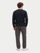 Model wearing the Cashmere V-Neck Sweater in Navy, back view