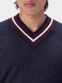 Close-up of the V-neck of the Cashmere Cricket V-Neck Sweater in Navy, wine red and white tipping on navy rib knit