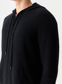 Men's Zip-Up Cashmere Hoodie Black worn by model, detail view on white background