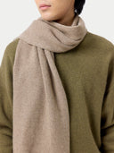 Cashmere Reversible Scarf Taupe worn by model, detail view on white background