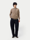 Beige zip-up sweater on a light gray background #color_taupe