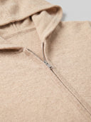 Close-up of the Seamless Unisex Zipper Hoodie in Beige, showing the front zip, the hood edge and the cashmere knit