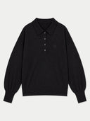 A black long-sleeve knit polo sweater with a three-button placket and a small tonal embroidered logo on the left chest, displayed on a light gray background.