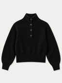 A black ribbed knit mock neck sweater with three front buttons, displayed flat against a light gray background.