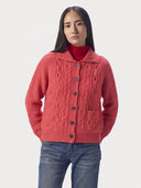 Model wearing the Bright Red cashmere cutaway-collar cable-knit cardigan with pointelle cables and patch pockets, front view
