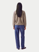 Model wearing the Cashmere V-Neck Cardigan in Taupe, back view