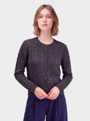 Cashmere Cable-Knit Crewneck Cardigan in black, worn by a model