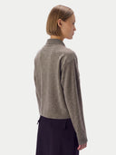 Model wearing the Cashmere-Silk Cropped Zip-Up Cardigan in Stone Taupe, back view