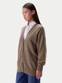 Model wearing the Cashmere Loose-Fit V-Neck Cardigan in Taupe, three-quarter view