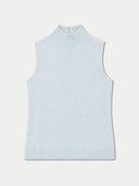 A light blue ribbed knit sleeveless mock neck sweater vest, displayed flat against a light off-white background.