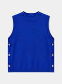 A bright royal blue sleeveless knit vest with a crew neck and decorative white buttons along the side seams, shown flat against a light gray background.
