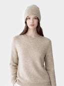 Model wearing the Cashmere Hat & Sweater Set in Natural Beige, close front view