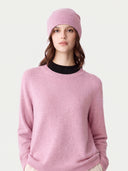 Model wearing the Cashmere Hat & Sweater Set in Light Pink, close front view