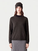 Model wearing the Cashmere Hat & Sweater Set in Olive Brown, front view
