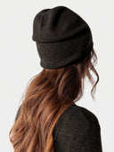 Model wearing the Cashmere Hat & Sweater Set in Olive Brown, back view