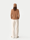 Model wearing the Cashmere Hat & Sweater Set in Leather Brown, back view