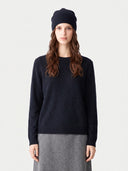Model wearing the Cashmere Hat & Sweater Set in Navy, front view