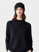 Model wearing the Cashmere Hat & Sweater Set in Navy, close front view