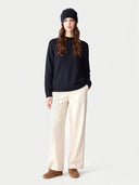 Model wearing the Cashmere Hat & Sweater Set in Navy, full-length front view