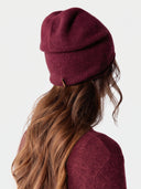 Model wearing the Cashmere Hat & Sweater Set in Wine Red, back view