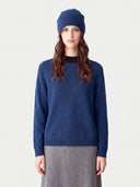 Model wearing the Cashmere Hat & Sweater Set in Deep Blue, front view
