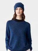 Model wearing the Cashmere Hat & Sweater Set in Deep Blue, close front view
