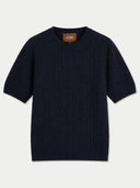 A dark navy blue short-sleeve knit sweater with a textured cable pattern, shown flat against a light gray background. The brand name 'GOBI' is visible on the inner neck label.