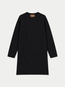 A black long-sleeve crewneck sweater dress with a textured cable knit pattern, shown flat on a white background. A small tan brand label reading 'GOBI' is visible inside the collar.