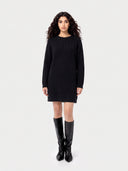 Model wearing the Seamless Cashmere Longline Cable Sweater in Black, full-length front view
