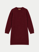A burgundy cable-knit sweater dress with long sleeves and a crew neck, shown flat against a light gray background. A small brown brand label reading 'GOBI' is visible inside the collar.
