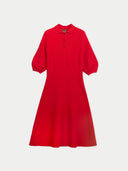 A bright red short-sleeve polo dress with a buttoned collar, displayed against a light gray background.
