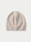 The Seamless Cashmere Cuffless Beanie in Natural Beige, flat lay front view