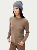 Model wearing the Seamless Cashmere Cuffless Beanie in Steel Gray, full-length front view