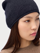 Model wearing the Seamless Cashmere Cuffless Beanie in Navy, close front view