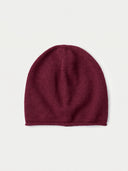 The Seamless Cashmere Cuffless Beanie in Wine Red, flat lay front view