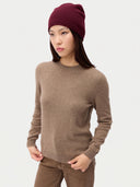 Model wearing the Seamless Cashmere Cuffless Beanie in Wine Red, full-length front view