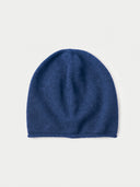 The Seamless Cashmere Cuffless Beanie in Deep Blue, flat lay front view