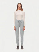 Model wearing the Cuffed Cashmere Jogger in light gray, full-length front view