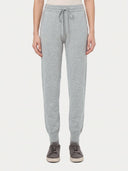 Model wearing the Cuffed Cashmere Jogger in light gray, front view from the waist down