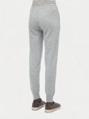Model wearing the Cuffed Cashmere Jogger in light gray, back view from the waist down