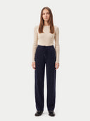 Model wearing the Cashmere Drawstring Straight-Leg Knit Pants in Navy, full-length front view