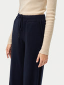 The Cashmere Drawstring Straight-Leg Knit Pants in Navy, close-up of the cashmere knit