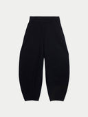 Black wide-leg cropped pants with a relaxed, balloon-like silhouette, shown flat against a light gray background.