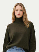 Women's T-Neck Organic Colour Cashmere Sweater Avocado worn by model, detail view on white background