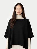 Women's Boat-Neck Cashmere Poncho Black worn by model, detail view on white background
